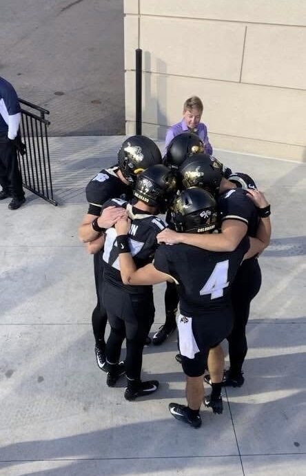 Quarterbacks huddled up before taking the field